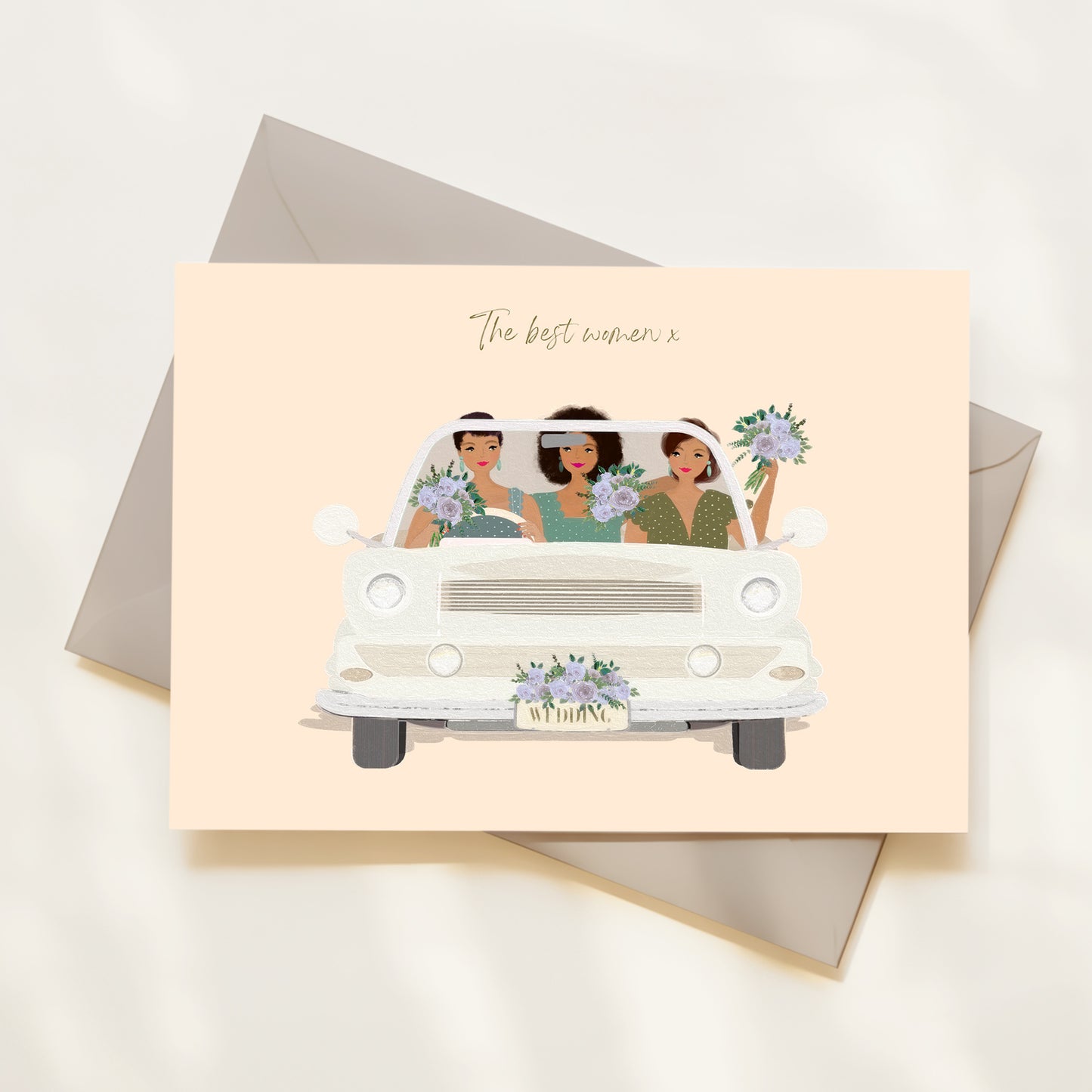 Greeting card with illustration of three women in a car, text 'The best woman', on a light pink background.