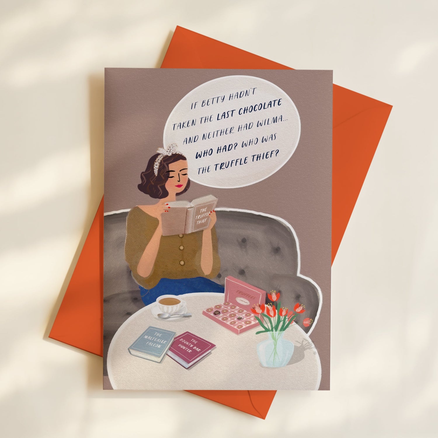 Illustrated greeting card of a woman reading a whodunnit mystery