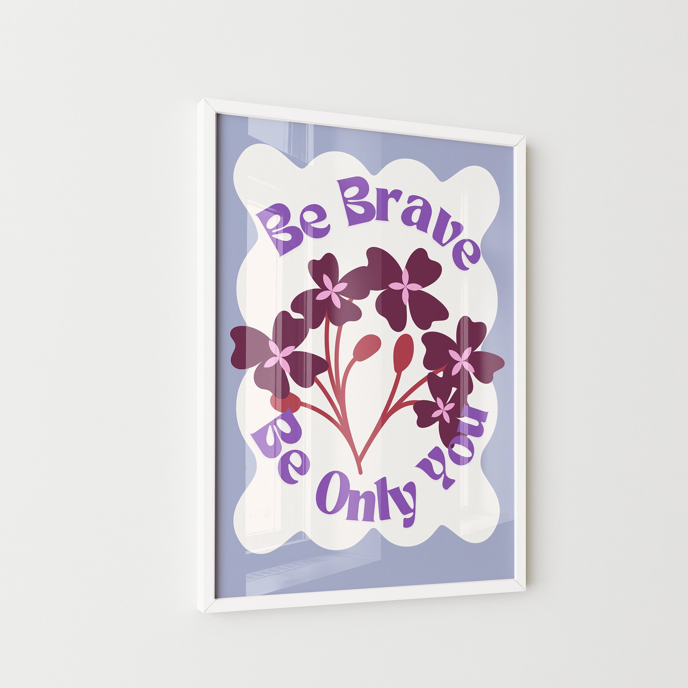 Framed artwork with floral design and motivational text on a light gray background