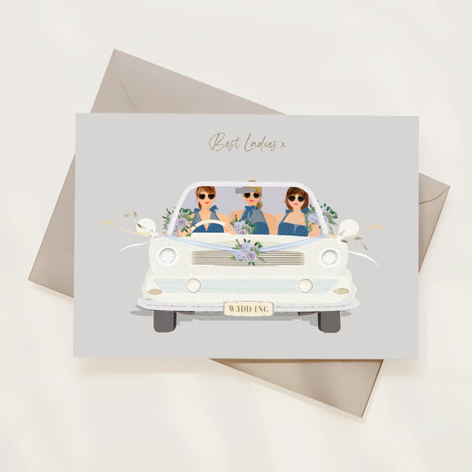 Wedding card with illustration of three bridesmaids in a vintage car, with 'Best Ladies' text above, on a light background.
