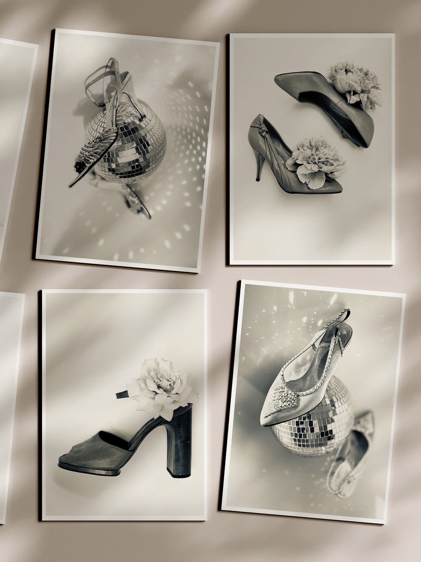 Four black and white photographs of high-heeled shoes on a reflective surface.