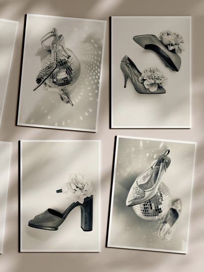 Four black and white photographs of high-heeled shoes on a reflective surface.