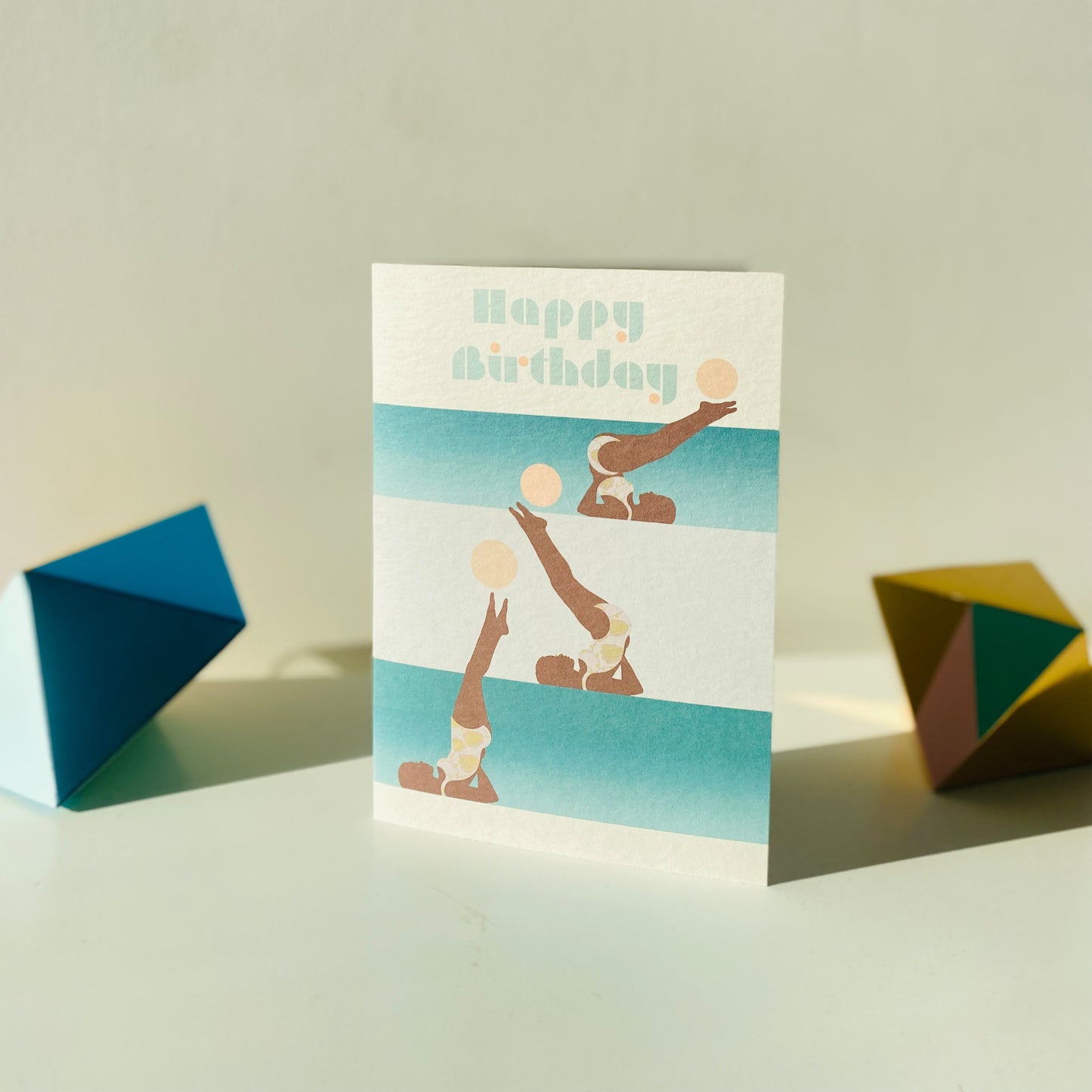 Birthday card with geometric design on a light background