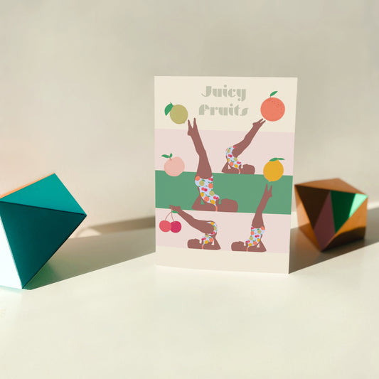 Greeting card with fruit-themed design on a light surface