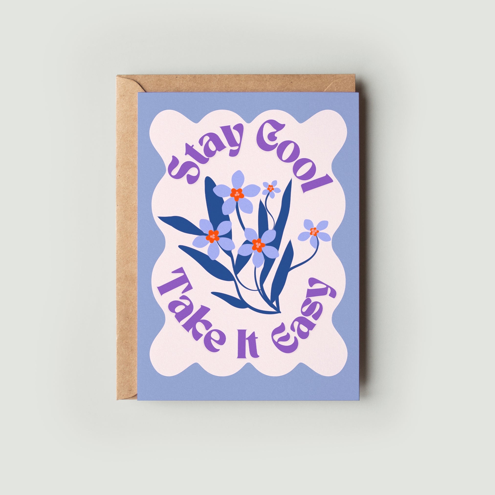 A greeting card with a floral design and the text 'Stay Cool Take It Easy' on the front, accompanied by a kraft envelope.
