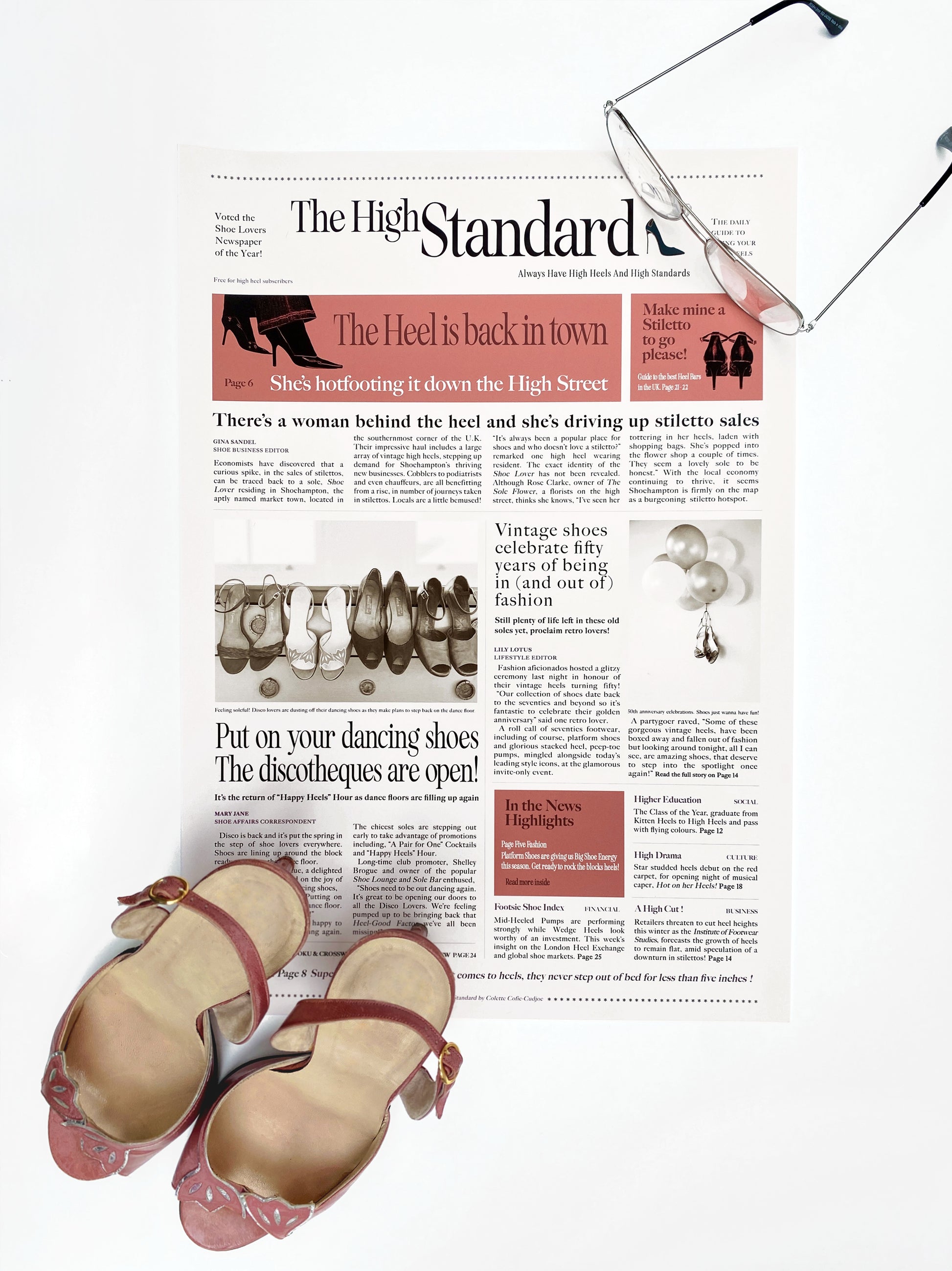 Newspaper styled art print with vintage shoes on a white background